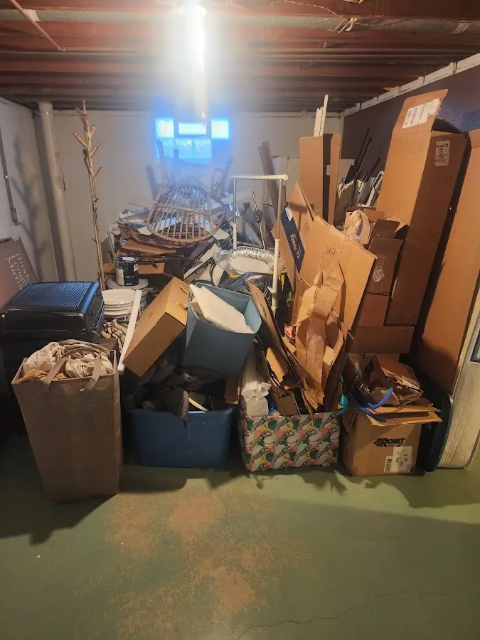 Roll-off dumpster container at job site for Concrete Dumpster Rental in Southport